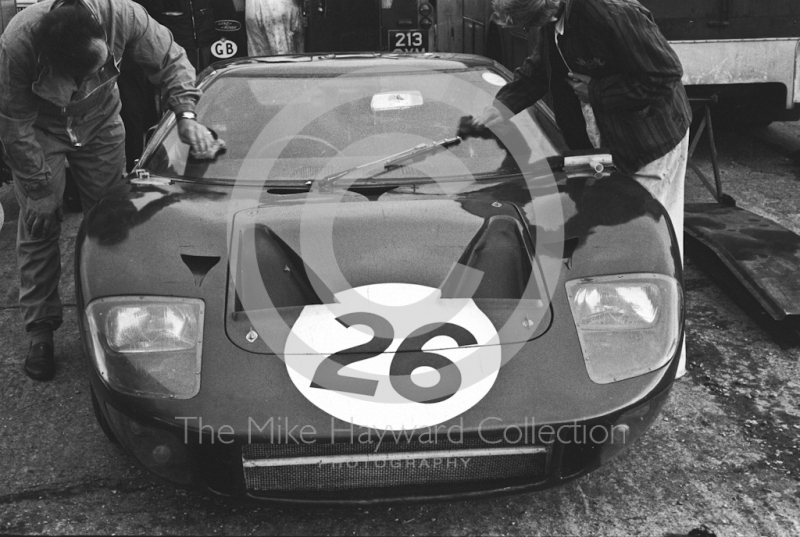 Peter Sutcliffe's Ford GT40 gets a shine in the paddock, Silverstone International Trophy sports car race, 1966
