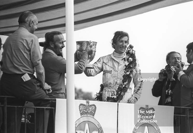 Jochen Rindt holds the trophy with Colin Chapman, British Grand Prix, Brands Hatch, 1970
