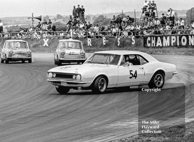 Thomas Lynch, Chevrolet Camaro, gets out of shape at Copse Corner in front of the Mini Cooper S's of Chris Montague (Alexander Engineering) and Gordon Spice, Ovaltine Trophy Touring Car Race, Silverstone, British Grand Prix, 1967.
