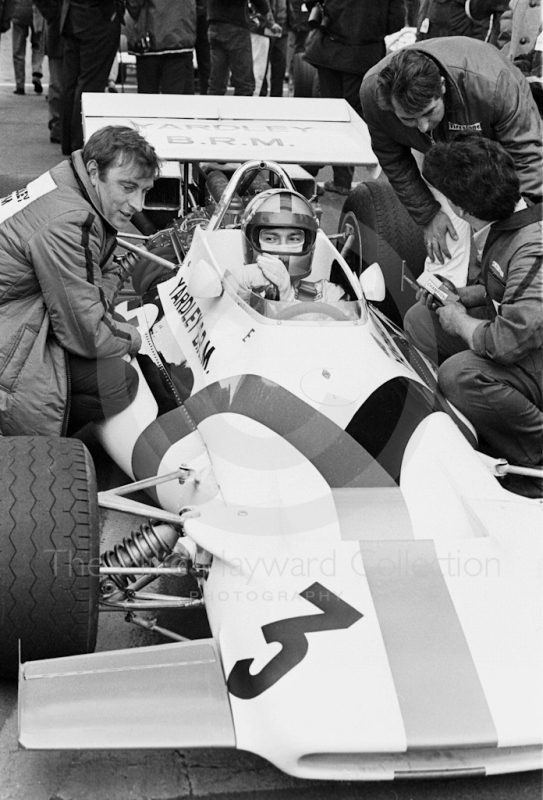 Pedro Rodriguez, Yardley BRM 160, chats to race technician Gerry Van der Weyden, left, on the grid before the Oulton Park Rothmans International Trophy, 1971.
