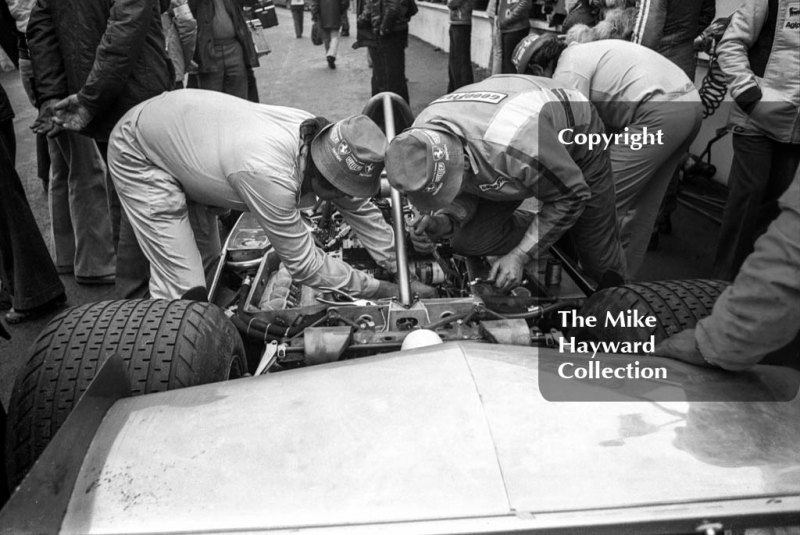 Ferrari mechanics in the pits work on Niki Lauda's Ferrari 312T/2, Race of Champions, Brands Hatch, 1976.
