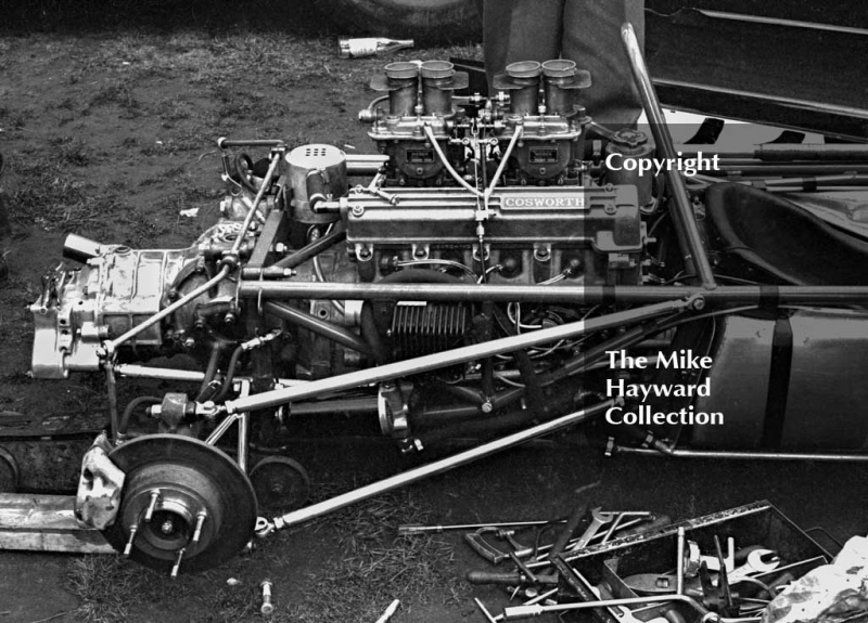 Cosworth engine in the pits, Oulton Park Gold Cup meeting, 1964.

