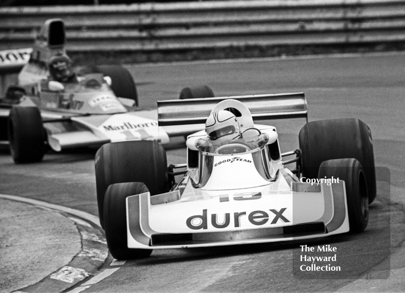 Alan Jones, Durex Surtees TS19, leads winner James Hunt, Marlboro McLaren M23, at Druids Hairpin, Race of Champions, Brands Hatch, 1976.
