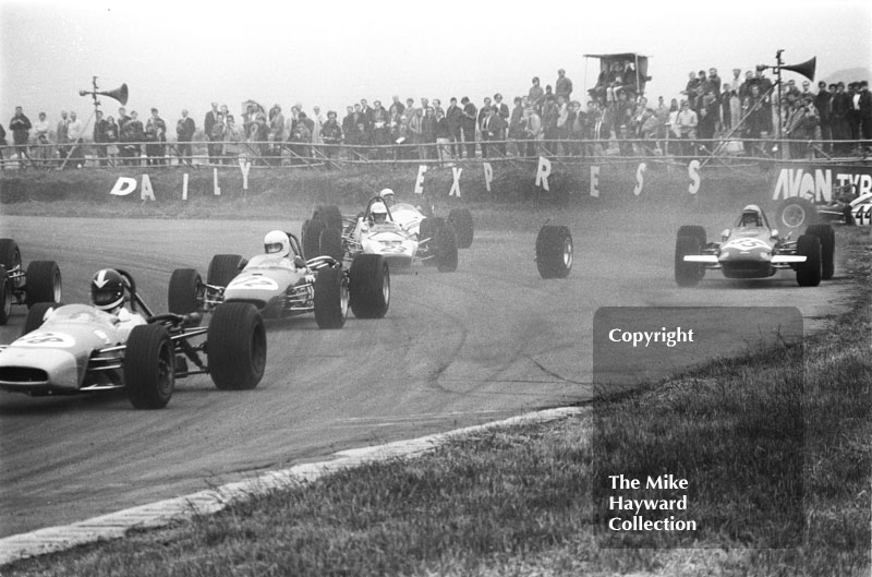 A stray wheel causes chaos at Copse Corner. Pictured are Ray Allen, EMC, John Collings, Peter Deal and Ken Bailey, Martini International Trophy Formula 3 race, Silverstone, 1970.
