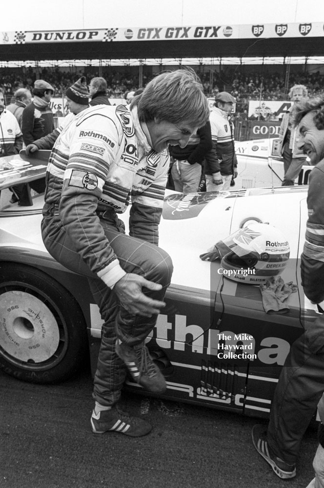 Derek Bell enjoys a joke on the grid before sharing a Rothmans Porsche 956 with Stefan Bellof and finishing 10th, World Endurance Championship, 1985&nbsp;Grand Prix International 1000km meeting, Silverstone.
