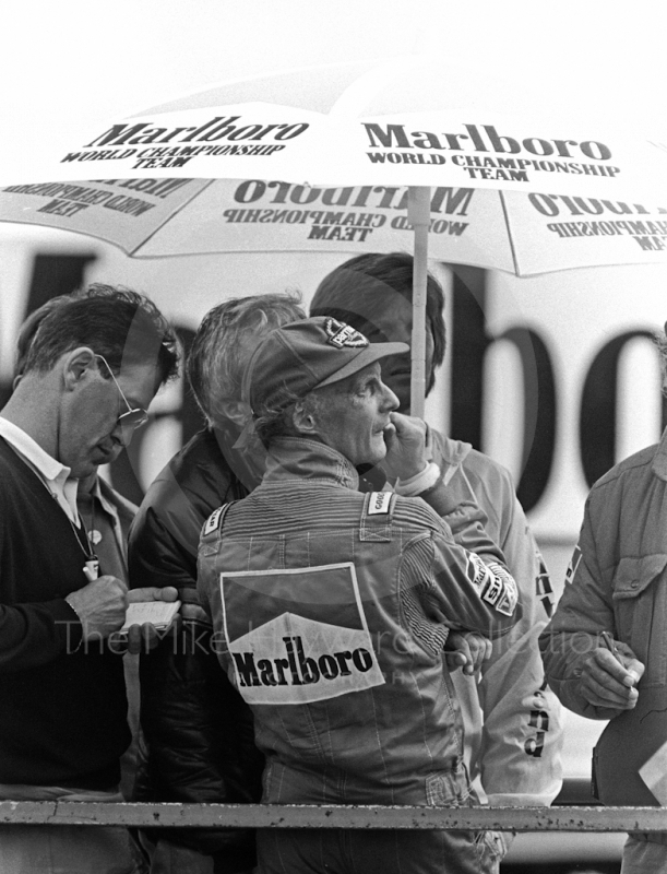 Niki Lauda watches proceedings from the pit wall during qualifying, British Grand Prix, Silverstone, 1985.
