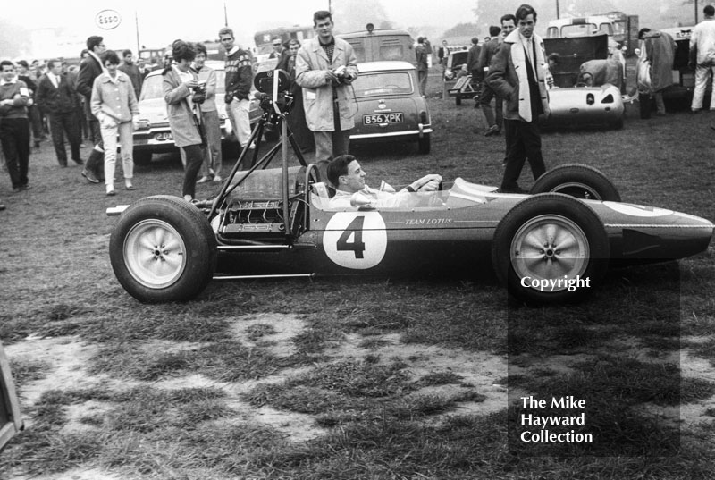 Jim Clark, Lotus 25&nbsp;with film camera, Oulton Park Gold Cup 1963.
