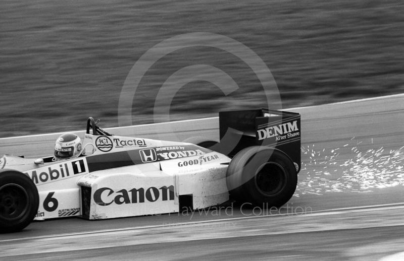Sparks fly as Keke Rosberg, Williams FW10, exits Paddock Bend, Brands Hatch, 1985 European Grand Prix.
