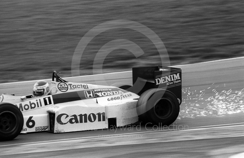 Sparks fly as Keke Rosberg, Williams FW10, exits Paddock Bend, Brands Hatch, 1985 European Grand Prix.
