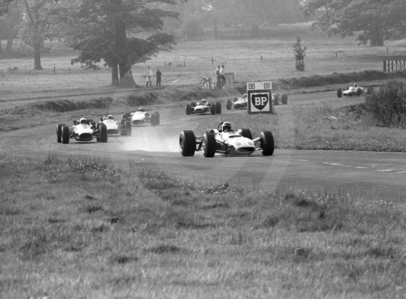 Jackie Stewart, Tyrrell Matra Ford MS7-02, leads the field into Esso Bend, Oulton Park, Guards International Gold Cup, 1967.
