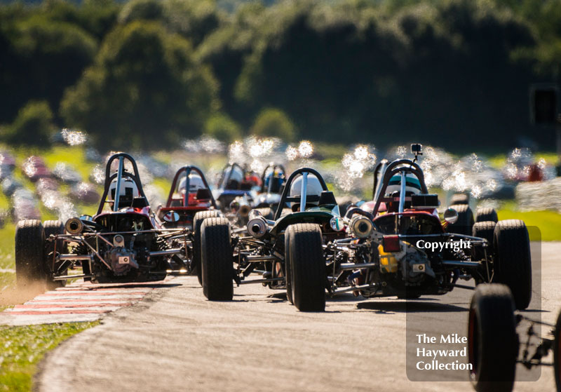 Formula Ford cars exiting Old Hall, 2016 Gold Cup, Oulton Park.
