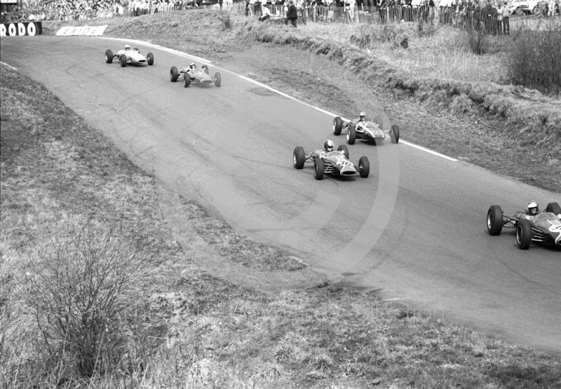 Piers Courage (38), Brabham BT10, Charles Lucas, Brabham BT10,and Warwick Banks, Cooper T76, lead the field through Deer Leap during the Formula 3 race at the Oulton Park Spring Race meeting, 1965.
