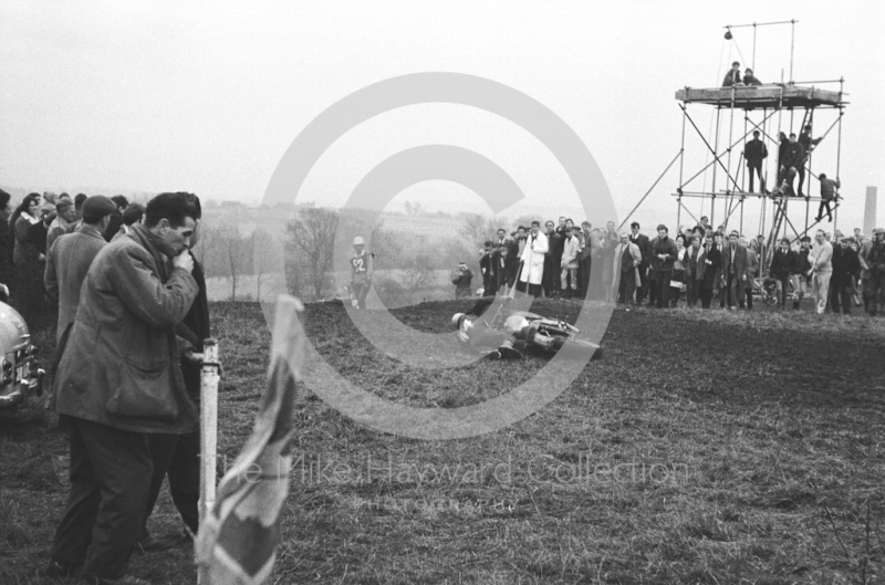 A fallen rider, motorcycle scramble at Spout Farm, Malinslee, Telford, Shropshire between 1962-1965