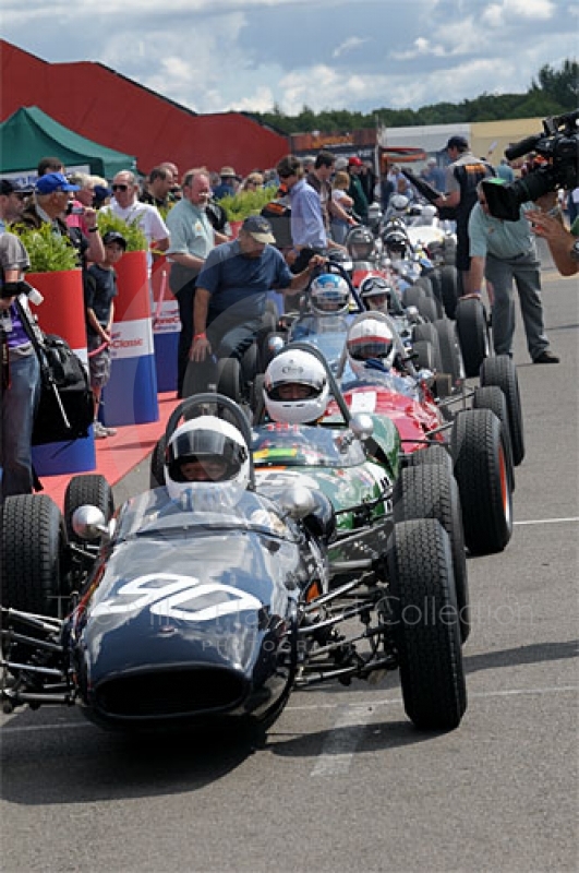 Emanuele Benedini, 1963 Brabham BT6, leads the queue in the paddock ahead of the Colin Chapman Trophy Race for Historic Formula Juniors, Silverstone Classic 2009.