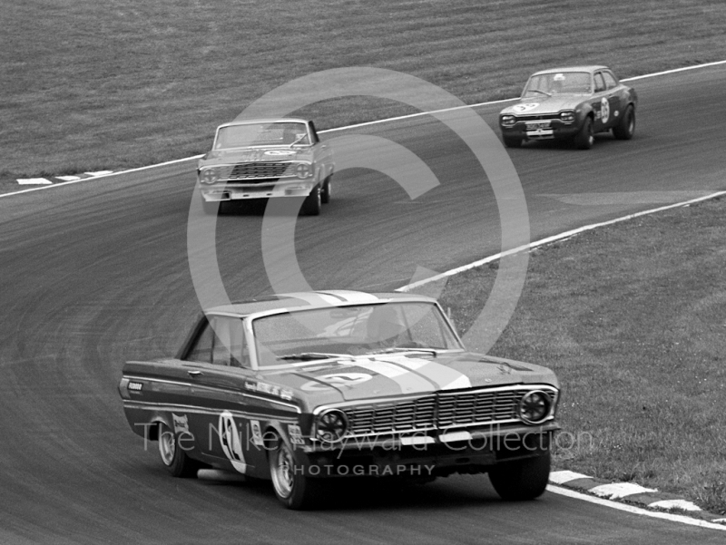 Brian Muir, Ford Falcon, leads through South Bank Bend, British Saloon Car Championship race, 1968 Grand Prix meeting, Brands Hatch.
