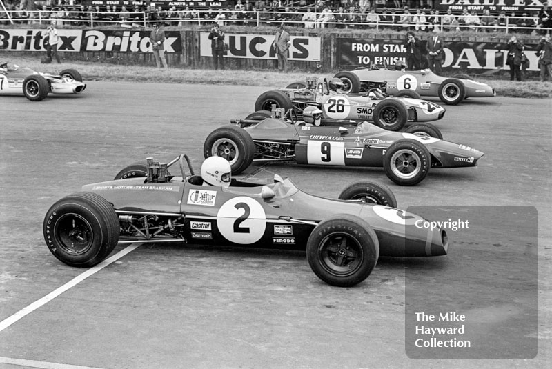 Tim Schenken, Sports Motors Brabham BT28; Reine Wisell, Chevron B15; Ronnie Peterson, Vick Scandanavia Tecno 69; and Bev Bond, Race Cars International Brabham BT28, Silverstone, British Grand Prix meeting 1969.
