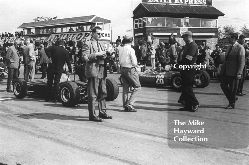 Formula 3 cars on the grid for the Radio London Trophy, with the Peter Sellers Racing Team Lotus 35 of Brian Hart in the centre, Silverstone, 1966
