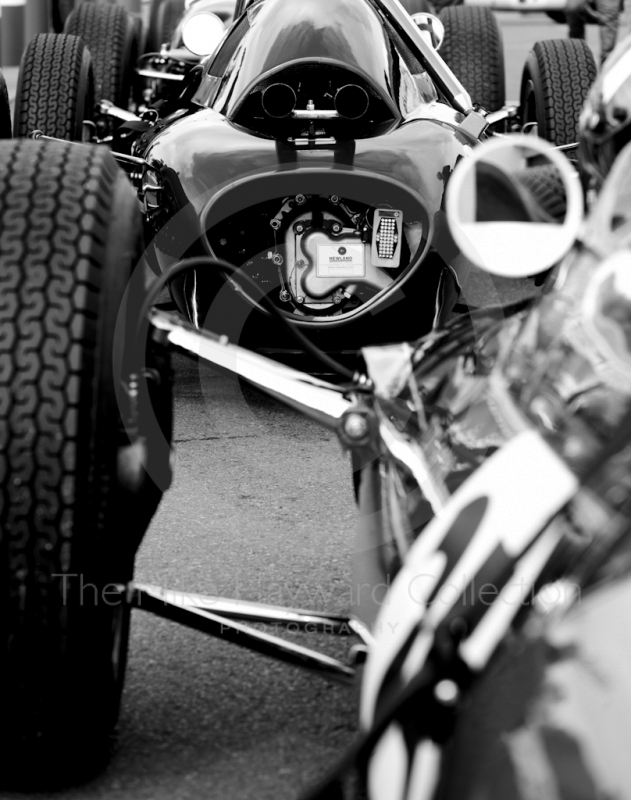 Black and white study of Lotus F1 cars before the HGPCA pre-66 Grand prix cars event, Silverstone Classic 2010