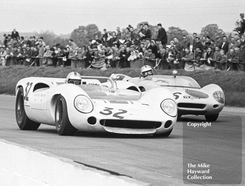 Denny Hulme, Sid Taylor Lola T70, and John Scott-Davies, Aintree Circuit Racing Team Lotus 19, Silverstone International Trophy meeting 1966.
