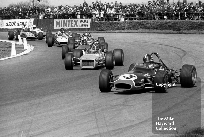 David Purley, LEC Brabham BT28, leads the pack at Copse Corner, followed by Barrie Maskell, Chevron B18, GKN Forgings Trophy, International Trophy meeting, Silverstone, 1971.
