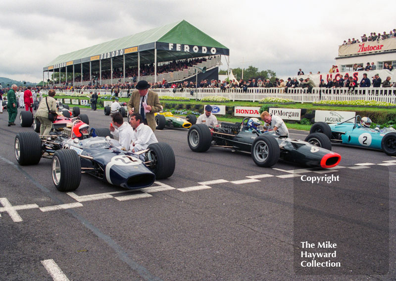 Front row for the Glover Trophy: Geoff Farmer, Rob Walker Lotus 49B; Paul Ingram, BRM P126; and John Beasley, Brabham BT11 Climax; Goodwood Revival, 1999
