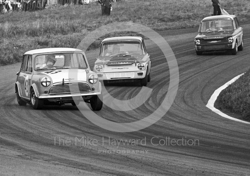 Chris Montague, Alexander Engineering Mini Cooper S, heading for 4th place in class, and timed at 110.97mph on Knickerbrook Straight, Oulton Park Gold Cup meeting, 1967. Following in his wake are Bernard Unett, Hillman Imp, and Tony Lanfranchi, also in a Hillman Imp.
