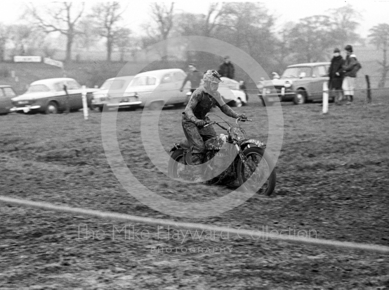 Rider covered in mud, Hatherton Hall Farm motocross, Nantwich, 1967