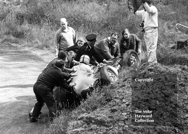 Marshals rush to the aid of John Creasey in his Lola at the Esses, Shelsley Walsh Hill Climb June 1967.
