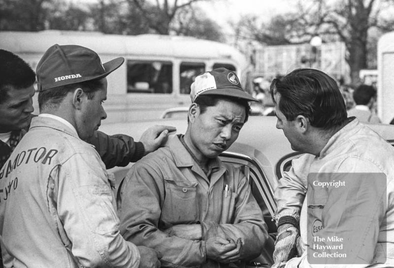 Jack Brabham chats to Honda mechanics in the paddock, Oulton Park, Spring International 1965.
