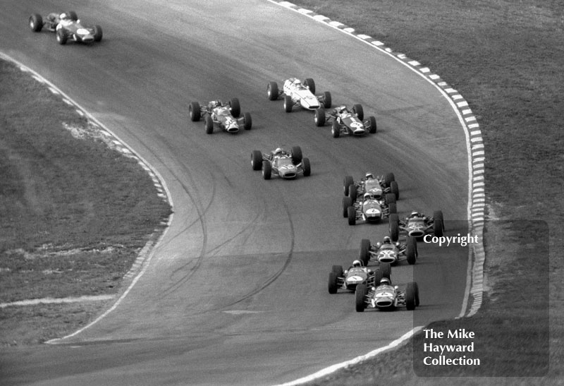 Jochen Rindt, Roy Winkelmann Brabham BT23-5, leads Jack Brabham, Motor Racing Developments Brabham BT23-2&nbsp;and the field through Paddock bend, Guards European F2 Championship, Brands Hatch, 1967
