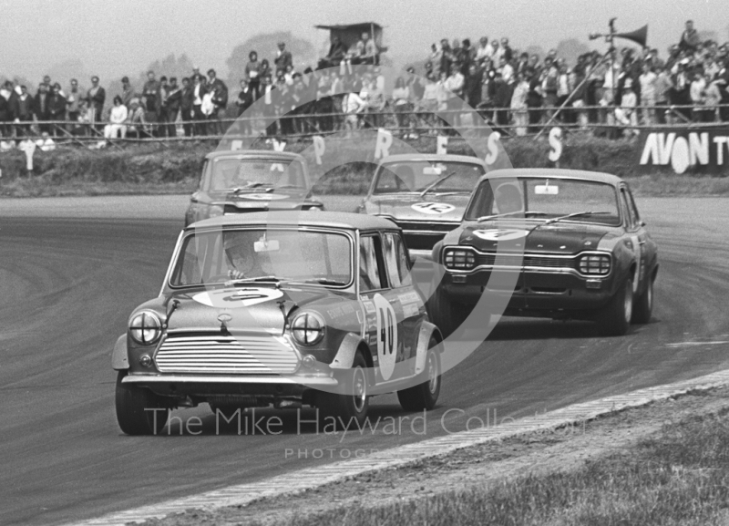 Gordon Spice, Equipe Arden Mini Cooper S, leads Zekia Redjep, Ford Escort, at Copse Corner, Silverstone Martini Trophy meeting 1970.
