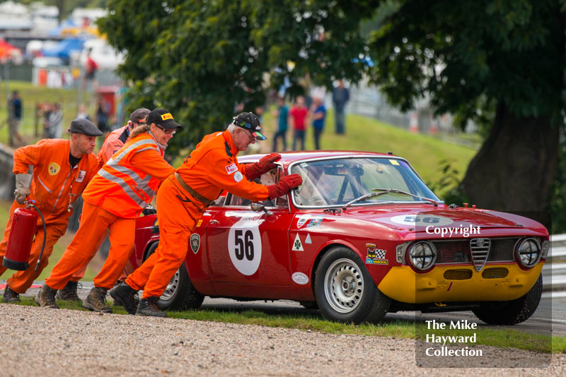 David Alexande's&nbsp;Alfa Romeo Sprint GT gets a push from the marshalls, HSCC Historic Touring Cars Race, 2016 Gold Cup, Oulton Park.
