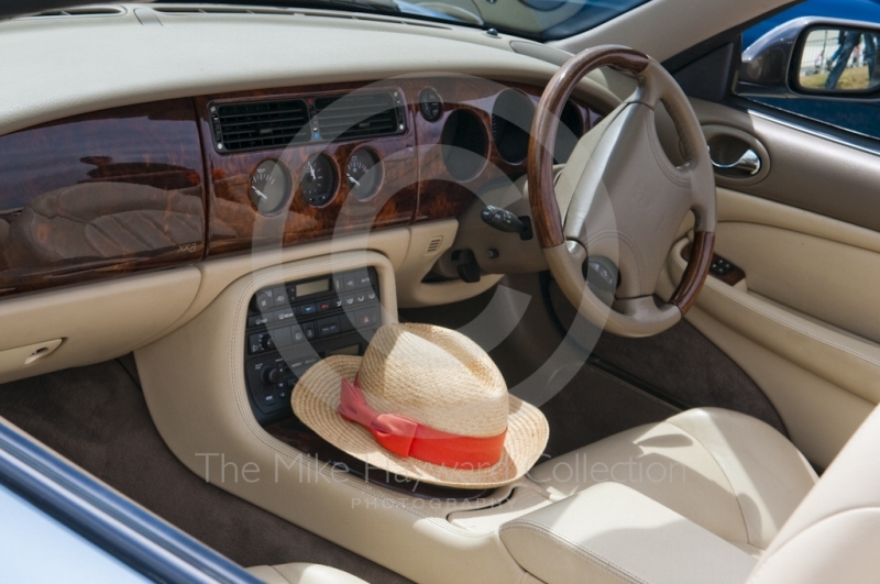 Jaguar XK8 and straw hat in the Jaguar Owners Club enclosure, Silverstone Classic 2010