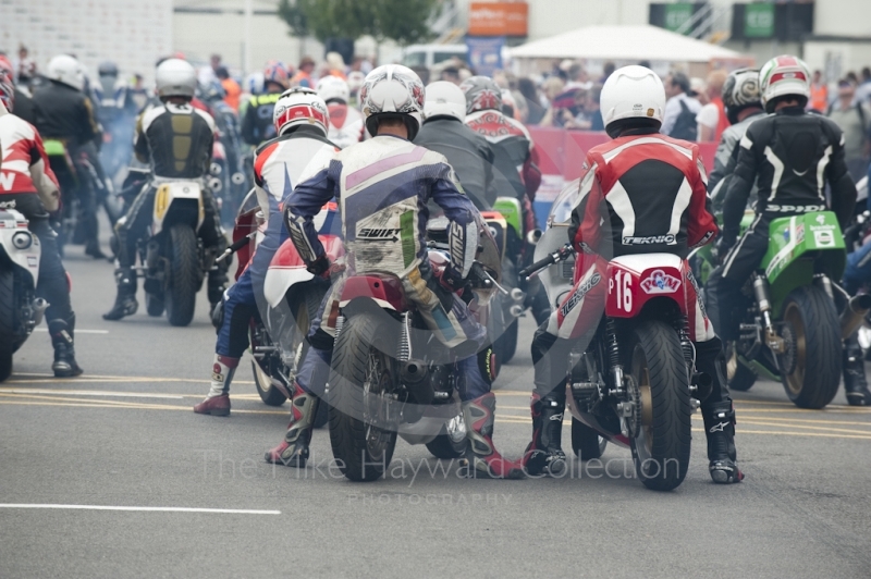 Classic bikes wait to go out on the circuit, Silverstone Classic, 2010