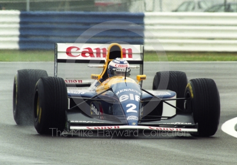 Alain Prost, Williams Renault FW15C, seen during wet qualifying at Silverstone for the 1993 British Grand Prix.
