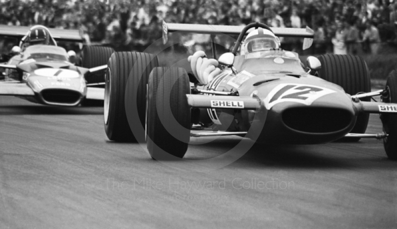 Pedro Rodriguez, Ferrari 312, and Graham Hill, Gold Leaf Team Lotus 49B, Silverstone, 1969 British Grand Prix.
