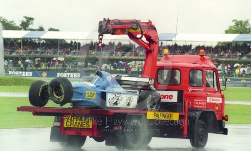 Mark Blundell's Ligier Renault JS39 is taken back to the paddock after crashing during qualifying at Silverstone for the 1993 British Grand Prix.
