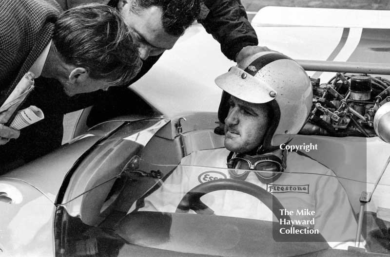 Denny Hulme on the grid in&nbsp;a&nbsp;Lola T70 at the Silverstone 1966 International Trophy.
