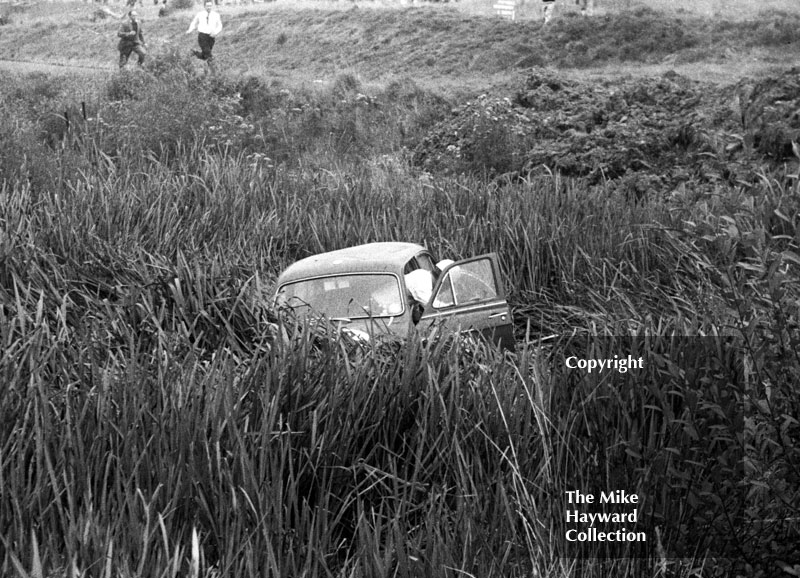 Alan Hutcheson gets out of his Riley 1.5 after going off at Knickerbrook, Oulton Park, Gold Cup meeting 1962.
