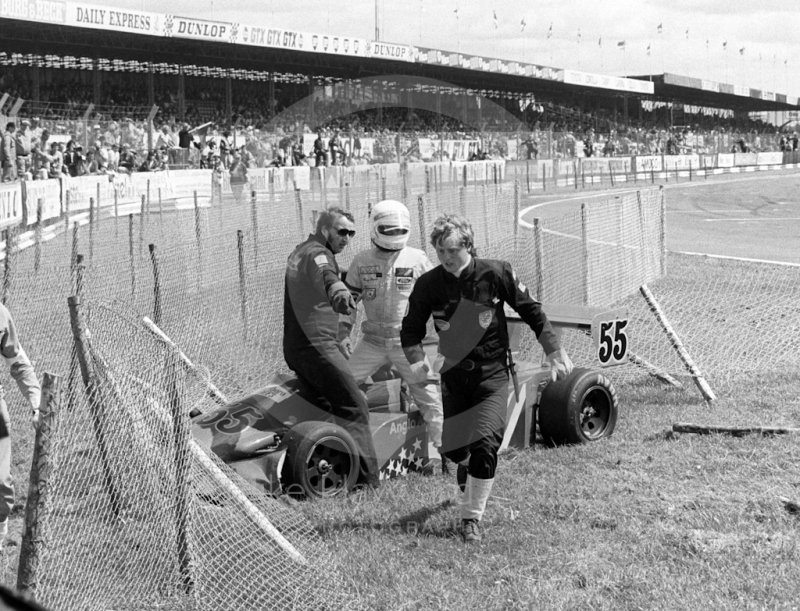 Ray Stover, Anglo American Racing Ralt RT3, starts the long walk back to the pits after crashing into the catch fencing, Formula 3 race, Silverstone, British Grand Prix 1985.
