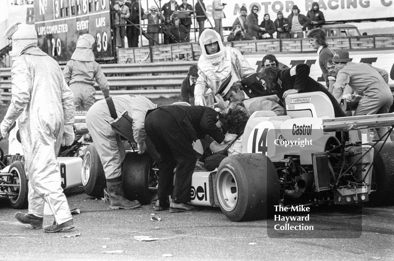 Marshalls helping Alberto Colombo after his March 752 BMW was involved in the chicane accident. Wella European Formula Two Championship, Thruxton, 1975
