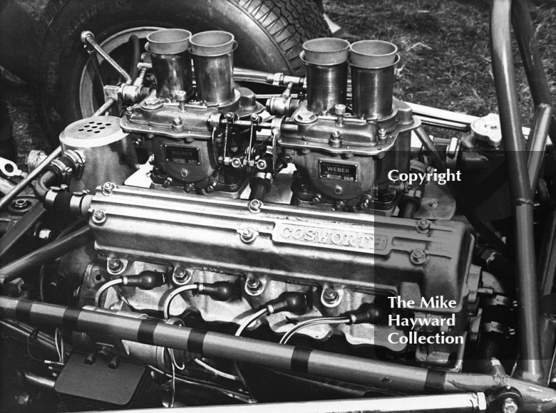 Cosworth engine in the pits, Oulton Park Gold Cup meeting, 1964.
