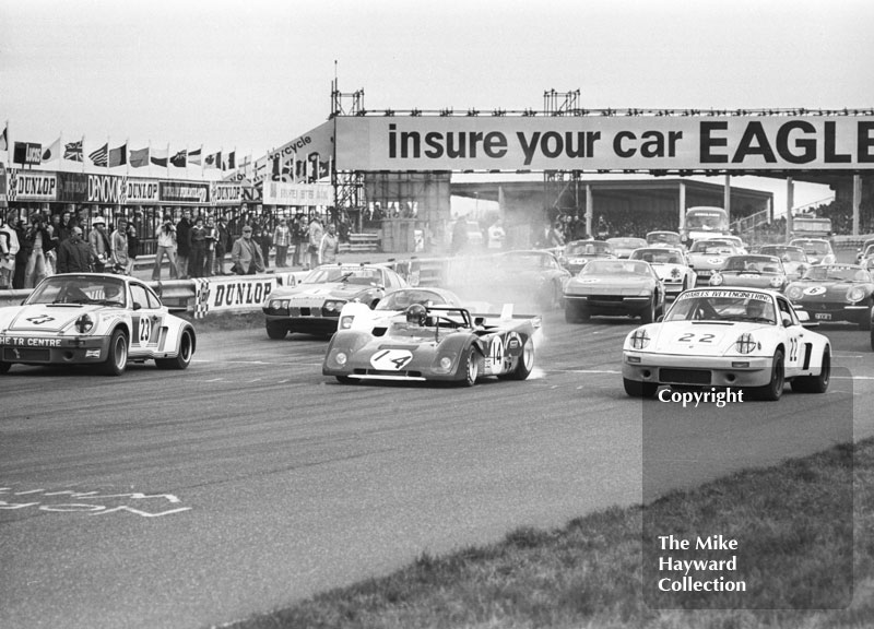 Starting grid - Mike Franey, Porsche Carrera, Louis Lorenzini, Ferrari 312P, and Larry Perkins, Porsche 911, Philips Car Radio Ferrari/Porsche race, F2 International meeting, Thruxton, 1977.
