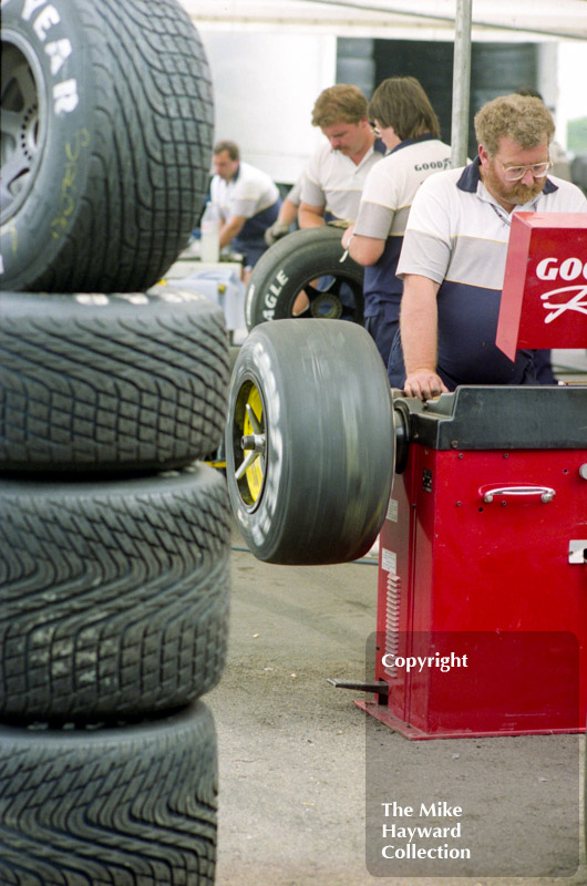 Goodyear technicians at work balancing tyres in the paddock, Silverstone, 1992 British Grand Prix.
