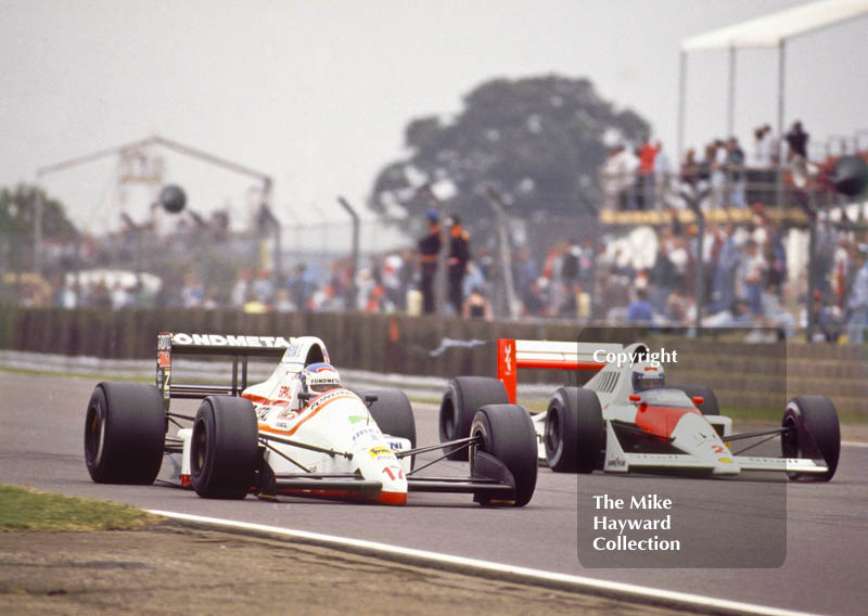 Nicola Larini, Osella FA1M, Cosworth V8, Alain Prost, McLaren MP4/5, Honda V10, British Grand Prix, Silverstone, 1989.
