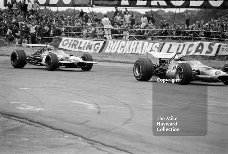 Bruce McLaren, McLaren M7C, and Jacky Ickx, Brabham BT26, Silverstone, 1969 British Grand Prix.
