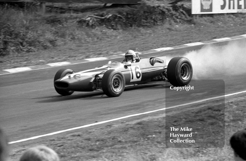 John Surtees, Lola T100 Ford, lays a smoke trail due to oil loss in heat 2, Guards European F2 Championship, Brands Hatch, 1967.
