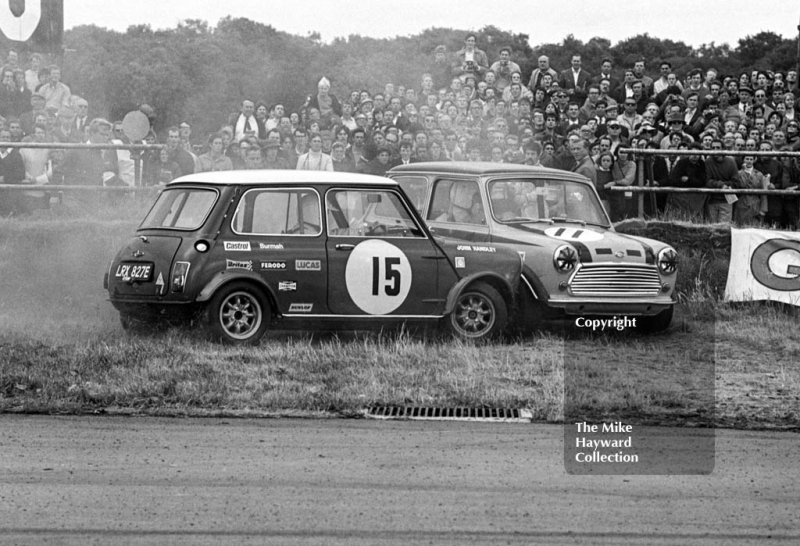 Steve Neal, Britax Cooper Downton Mini Cooper S, and John Handley, British Leyland Mini Cooper S, have a coming together at Copse Corner, Silverstone, British Grand Prix meeting 1969.
