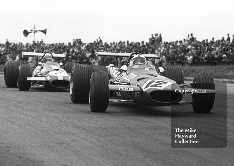 Pedro Rodriguez, Ferrari 312, and Jacky Ickx, Brabham BT26, Silverstone, 1969 British Grand Prix.
