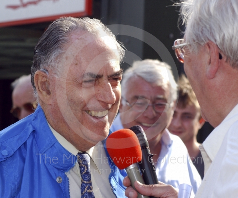 Jack Brabham being interviewed in the pit lane, Oulton Park Gold Cup, 2002